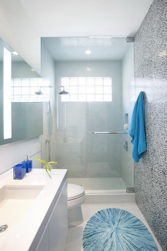 a light blue bathroom with a framed window, a shower space and a floating sink with a square tub