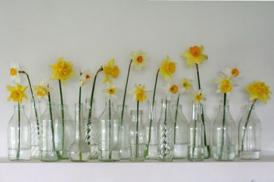 sheer vases with single daffodils in each for a pretty rustic cluster decoration or a vintage one