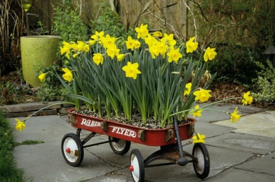 a garden cart with daffodils is a pretty modern spring decor idea to make
