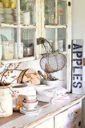 a cool arrangement with branches for fall kitchen decor
