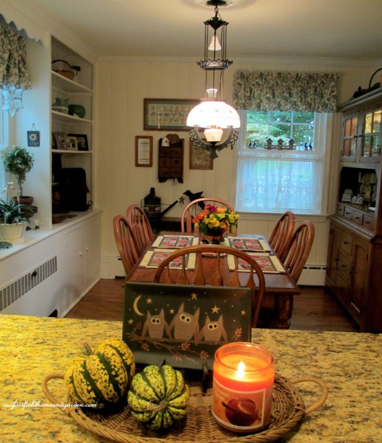 a simple arrangement of a fall candle and green pumpkins is an easy idea to brign a fall feel to the space a simple arrangement of a fall candle and green pumpkins is an easy idea to brign a fall feel to the space