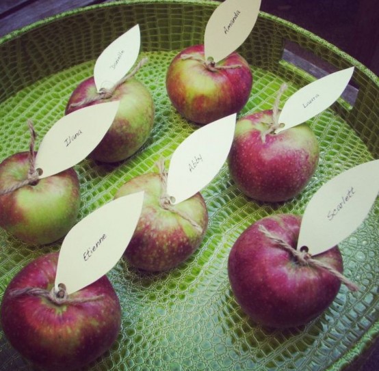 apples topped with paper leaves will be nice place cards and favors for a cool fall party
