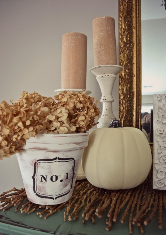 blush candles in vintage candleholders, a white pumpkin and a whitewashed pot with dried hydrangeas for a fall party
