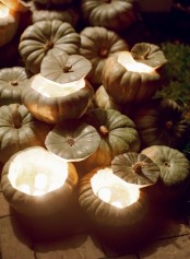 natural pumpkins with candles inside work as real decorations and candleholders are amazing