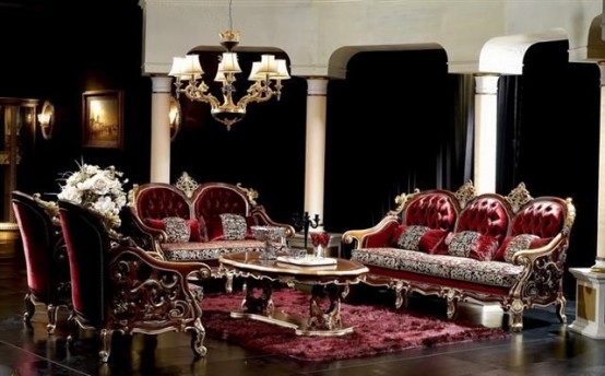 a sophisticated Gothic living room with black curtains, burgundy velvet furniture, a gold coffee table and a chandelier