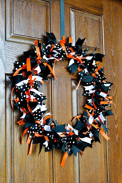 a bold Halloween wreath covered with black, white, orange and polka dot fabric pieces is a pretty solution for Halloween