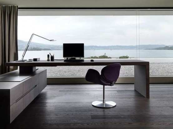 a modern home office with a glazed wall and a sea view that is very peaceful, a built-in desk and a chair, a storage unit is a lovely space for working