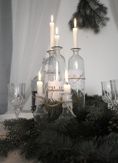 neutral vintage bottles holding candles are a lovely decoration or a centerpiece for styling your space, they look nice and hold candles with style