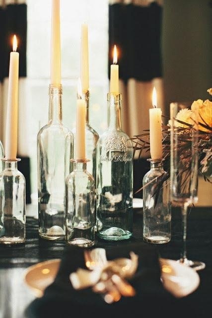 vintage bottles as candleholders can be used for creatign a lovely and spiritual centerpiece that will create a mood and an intimate feel