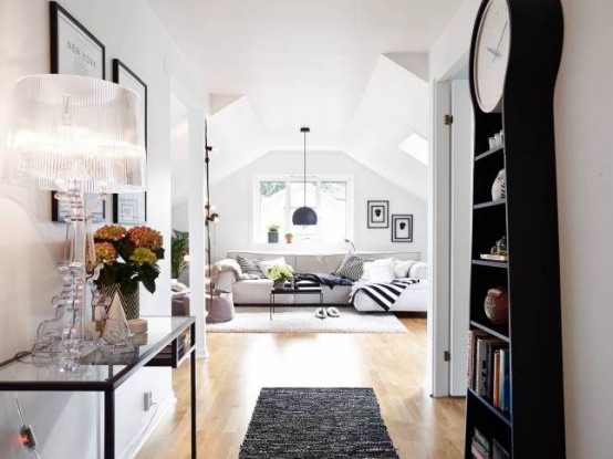 a black Cittsjo table as a console with a large table lamp, blooms and some decor is a lovely idea for a tight space