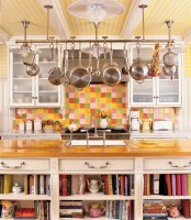 a holder over the kitchen island is great for hanging pans and pots and you will save a lot of shelf space