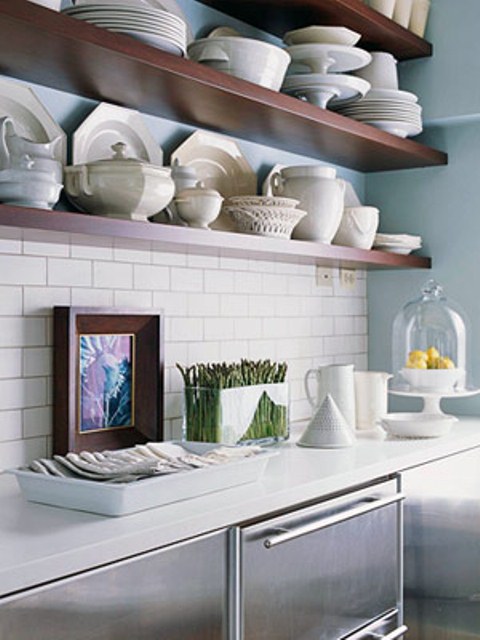long open shelves attached to the wall over the cabinets are great for storing tableware and various stuff for cooking