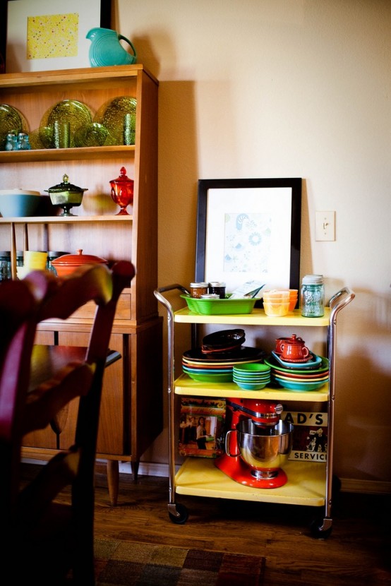 an open shelving unit and a kitchen cart, which is a great idea for open storage