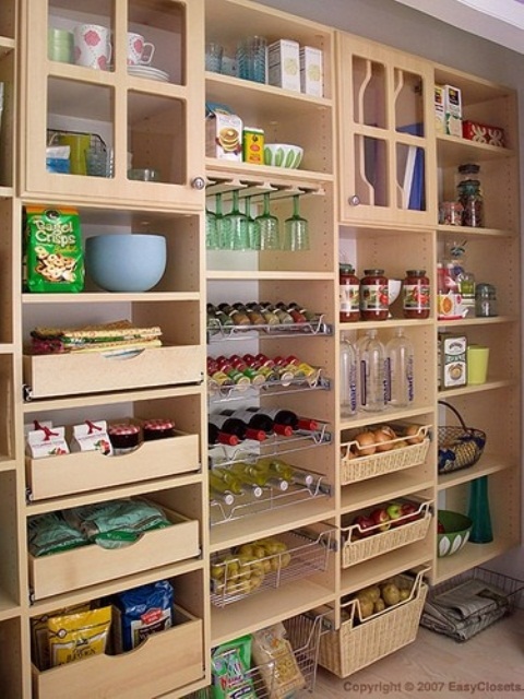 a large storage unit with open compartments, drawers, glass compartments is an awesome piece to store a lot of stuff