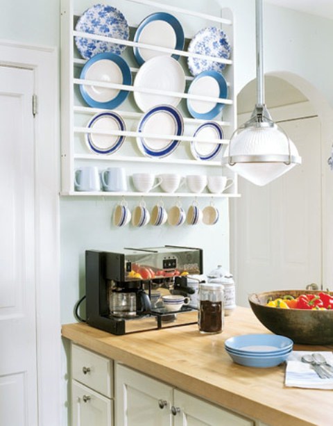 a rack holding the plates and mugs, with hooks to hang more cups is a cool way to store and display your tableware