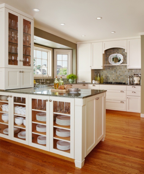 a storage kitchen island with glass doors to store all kinds of tableware and mugs is a smart idea