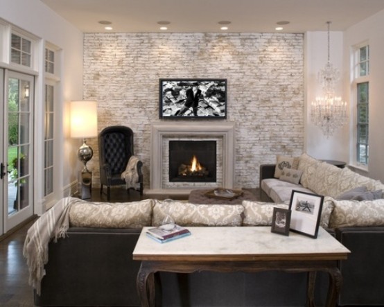 an elegant and refined living room with a whitewashed brick statement wall that adds a casual feel