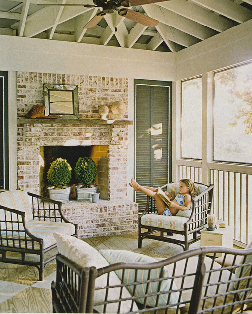 an English farmhouse cottage living room with whitewashed red bricks for a vintage feel in the space