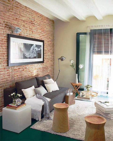 a contemporary living room with a red brick statement wall for more texture and interest