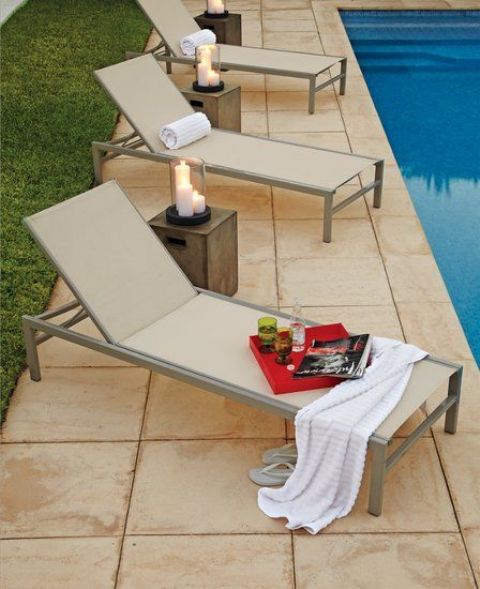 minimalist metal and fabtic loungers in neutral shades are perfect for placing them by the pool and relaxing on them