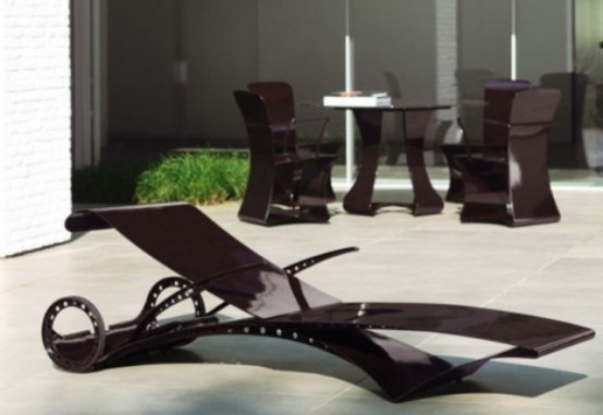 a dark metal lounger with casters looks very futuristic and very contemporary, it will make a stylish statement in your outdoor space