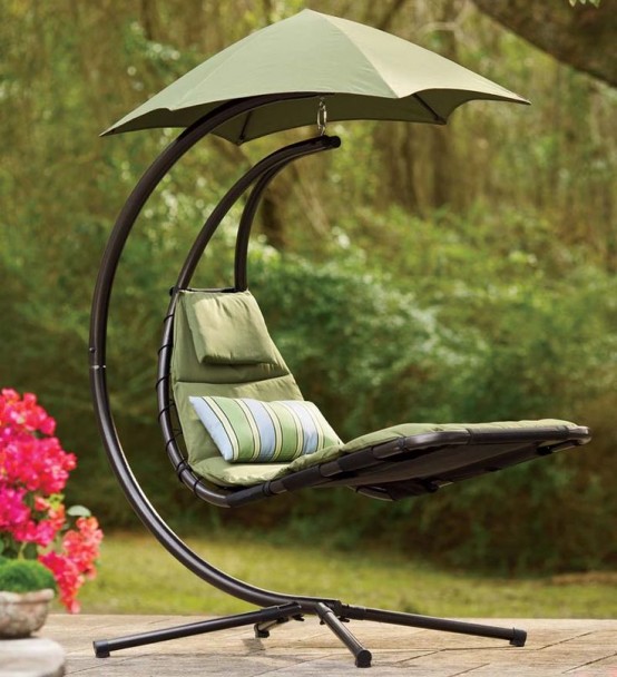 a statement outdoor lounger suspended on a metal base and with an umbrella to save your from excessive sunlight