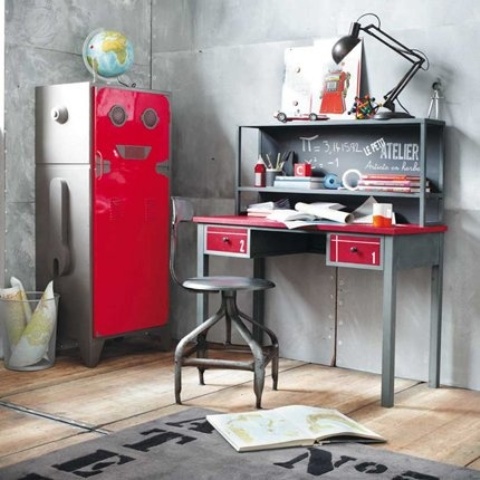 a quirky industrial working space with a red metal storage unit, a metal grey and red desk and a black stool plus a metal lamp looks bold and unusual
