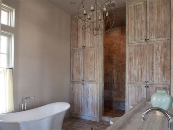 a weathered and shabby chic wood bathroom with vintage items and touches