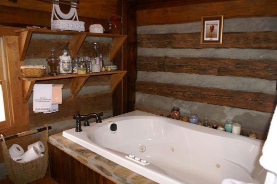 a wooden bathroom with some stone looks rustic and chalet-inspired