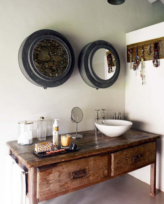 a wooden vanity and a wooden holder for the jewelry bring a rustic and vintage touch