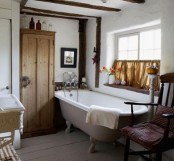 White Cottage Rustic Bathroom Oak Wood Ceiling Beams Freestanding Roll Top Bath Painted Floorboards Antique Wardrobe Window With Half Curtain  Real Home CH&I 11/2009 Pub Orig