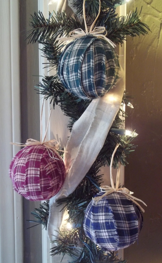 an arrangement of Christmas ornaments wrapped with blue and red plaid fabric