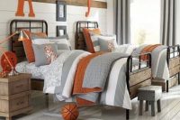 a rustic vintage shared teen boy bedroom with white walls, metal beds, wooden furniture and neutral and orange textiles