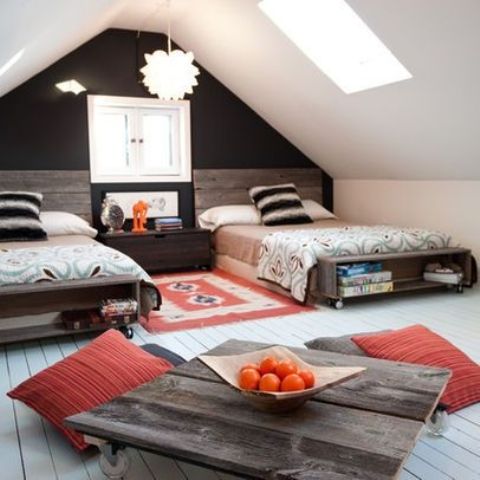a rustic attic shared teen boy bedroom with pallet beds wiht storage, a pallet coffee table and skylights