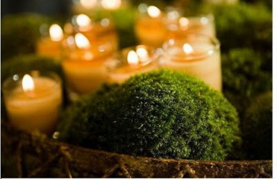 a bowl with moss balls and candles in glasses are great for a simple spring centerpiece