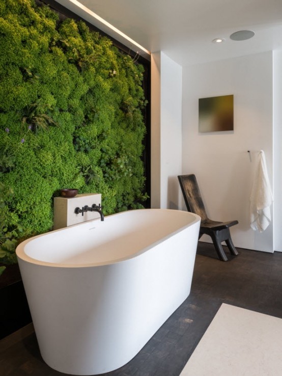 a living moss wall in your bathroom will make it feel outdoorsy during any season of the year, and it's a trendy decor feature