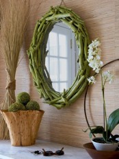 a wooden bowl with moss balls is a cool decoration or centerpiece for any springy feel