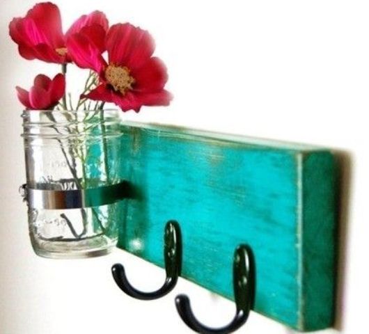 a small vintage and rustic turquoise rack with hooks and holders is an easy DIY to add a bit of color to the space