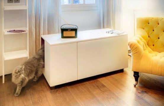 a sleek white cabinet with a cat litter box inside in your living room will keep the cat's privacy