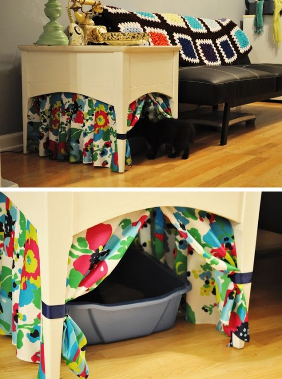 a side table with colorful curtains for some privacy plus a cat litter box inside is a simple idea for a modern space