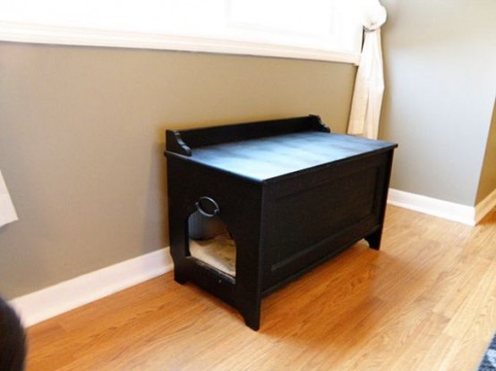 a small black bench with a cat litter box inside can double as a cat bed and can be placed in your entryway