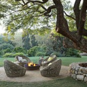 a modern outdoor space with a fire pit, wicker papasan chairs is an ideal place to spend some time and enjoy fresh air