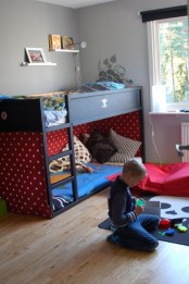 All black IKEA Kura bed for a boys room