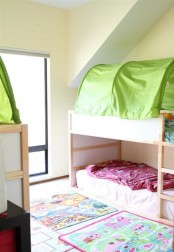 IKEA Kura bed in an attic kids room
