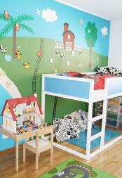Blue-white Ikea Kura bed in a cute kids room
