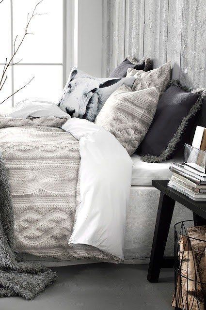 lots of fur and knit pillows and blankets raise your bedroom decor to a new level and make it wintry