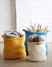 beautiful and colorful crocheted baskets for storing firewood, yarn and blankets are a veyr cool idea to add coziness to your home
