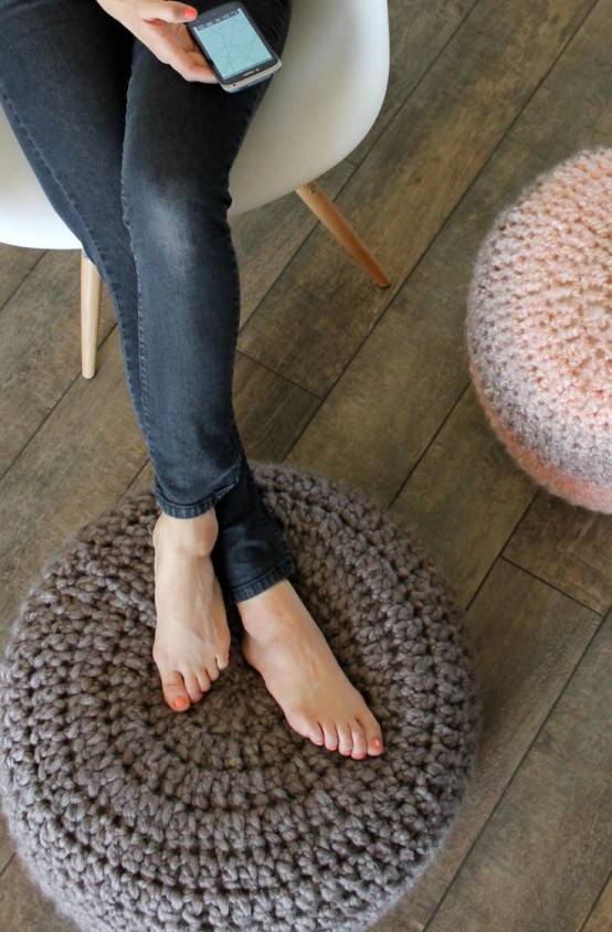 pretty round crocheted poufs will accessorize and accent your space in a cool way, and they can double as footrests