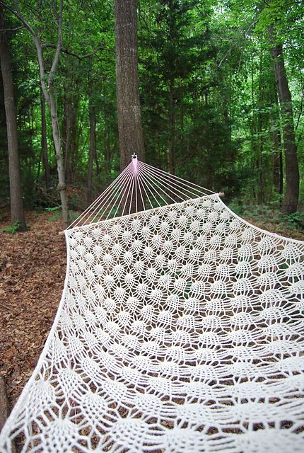 a white crocheted hammock is a cool idea to relax, it can fit both outdoor and indoor spaces