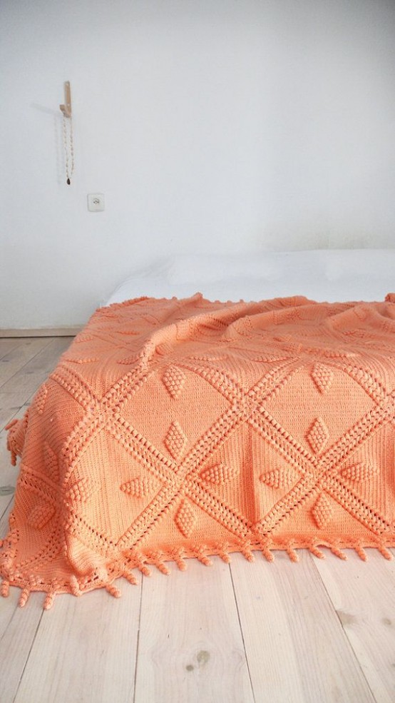 a bright crocheted blanket can be used to cover the bed or to add a bit of color and coziness to your space, both indoor or outdoor
